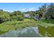 Aerial view of a waterfront property with lush landscaping at 1803 E Kaley Ave, Orlando, FL 32806