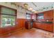 Kitchen with wood cabinets, granite countertops, and wood floors at 1803 E Kaley Ave, Orlando, FL 32806