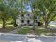 Two-story house with a large front yard and mature trees at 1803 E Kaley Ave, Orlando, FL 32806