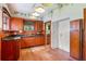 Kitchen with wood cabinets, granite countertops and wood floors at 1803 E Kaley Ave, Orlando, FL 32806