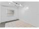 Bright bonus room with tile floors and neutral walls at 1803 E Kaley Ave, Orlando, FL 32806