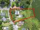 Aerial view of property and surrounding area near lake at 1803 E Kaley Ave, Orlando, FL 32806