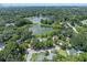 Wide aerial view of property and neighborhood near lake at 1803 E Kaley Ave, Orlando, FL 32806