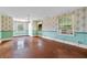 Bedroom with hardwood floors and floral wallpaper at 1803 E Kaley Ave, Orlando, FL 32806