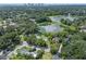 Aerial view showing home near lake and city skyline at 1803 E Kaley Ave, Orlando, FL 32806
