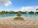 Community pool with fountain and landscaping at 4963 Pall Mall E St, Kissimmee, FL 34758