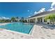 Relaxing community pool with patio and fountain at 4963 Pall Mall E St, Kissimmee, FL 34758