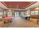 Game room with pool table and air hockey at 4963 Pall Mall E St, Kissimmee, FL 34758