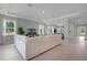 Open living area features a large sectional sofa and tile floors at 3443 Islewood Ct, Ocoee, FL 34761