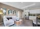 Open living room featuring a sectional sofa, coffee table, and access to the kitchen at 3443 Islewood Ct, Ocoee, FL 34761