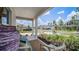 Relaxing front porch with seating, a view of the street, and neighborhood at 1105 Pacific Dunes Ct, Daytona Beach, FL 32124
