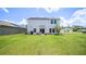 Large backyard with patio, grill, and solar panels at 1105 Pacific Dunes Ct, Daytona Beach, FL 32124