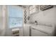 Laundry room with washer, dryer, and ample shelving at 1105 Pacific Dunes Ct, Daytona Beach, FL 32124