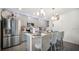 Modern kitchen with gray cabinets and a large island at 1105 Pacific Dunes Ct, Daytona Beach, FL 32124