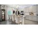 Modern kitchen with gray cabinets and white countertops at 1105 Pacific Dunes Ct, Daytona Beach, FL 32124