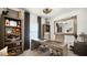 Home office with large desk, two chairs, and built-in shelving at 1105 Pacific Dunes Ct, Daytona Beach, FL 32124