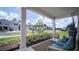 Front porch with seating area and view of the neighborhood at 1105 Pacific Dunes Ct, Daytona Beach, FL 32124