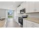 Modern kitchen with stainless steel appliances and granite countertops at 1733 Forest Run Ln, Auburndale, FL 33823