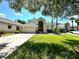 Two-story house with a two-car garage and manicured lawn at 1817 Baillie Glass Ln, Orlando, FL 32835