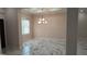 Formal dining room with marble floors and chandelier at 245 Little Brown Church Rd, Pierson, FL 32180