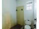 Simple bathroom with toilet and tiled walls at 1440 Walker Rd, Lakeland, FL 33810