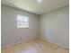 Bedroom with a window and neutral-colored walls at 1440 Walker Rd, Lakeland, FL 33810