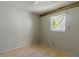 Small bedroom with a window and light walls at 1440 Walker Rd, Lakeland, FL 33810