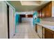 View of kitchen, showing cabinets and appliances needing updates at 1440 Walker Rd, Lakeland, FL 33810