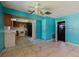 Living room with tiled floors, exposed beams and teal walls at 1440 Walker Rd, Lakeland, FL 33810