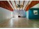 Living room features high ceilings, exposed beams, and a stone fireplace at 1440 Walker Rd, Lakeland, FL 33810