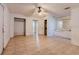 Main bedroom with tiled floors, ceiling fan and walk in closet at 1440 Walker Rd, Lakeland, FL 33810