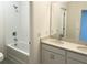 Bathroom with double vanity, bathtub, and shower at 6821 Serpent Hawk Lane St, Howey In The Hills, FL 34737