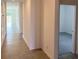 Bright hallway with tile floors and access to other rooms at 6821 Serpent Hawk Lane St, Howey In The Hills, FL 34737