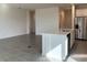 Eat-in kitchen with island, stainless steel appliances, and white cabinets at 6821 Serpent Hawk Lane St, Howey In The Hills, FL 34737