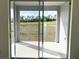 Sliding glass doors leading to a private patio overlooking open space at 6821 Serpent Hawk Lane St, Howey In The Hills, FL 34737