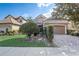 Two-story house with tile roof, landscaped yard, and paved driveway at 8503 Saint Marino Blvd, Orlando, FL 32836