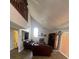 Spacious living room featuring high ceilings, a fireplace, and a loft area at 2603 Coventry Ln, Ocoee, FL 34761