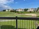 Community view with green spaces and buildings at 1597 Heritage Crossing Ct # 202, Reunion, FL 34747