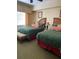 Guest bedroom with two twin beds and comfortable seating at 1597 Heritage Crossing Ct # 202, Reunion, FL 34747