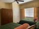 Spacious bedroom with two twin beds and large window at 1597 Heritage Crossing Ct # 202, Reunion, FL 34747