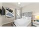 Bedroom with a TV and en-suite bathroom at 7770 Sandy Ridge Dr # 117, Reunion, FL 34747