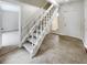 Staircase with white railing and carpeted steps at 4934 Samoa Cir # 7, Orlando, FL 32808