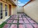 Small patio with brick pavers, ideal for outdoor relaxation at 4934 Samoa Cir # 7, Orlando, FL 32808