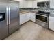 Bright kitchen with stainless steel appliances and granite countertops at 4934 Samoa Cir # 7, Orlando, FL 32808