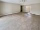 Spacious living room with French doors to patio at 4934 Samoa Cir # 7, Orlando, FL 32808