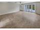 Bright living room with French doors leading to patio at 4934 Samoa Cir # 7, Orlando, FL 32808
