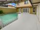 Inviting pool area with large patio and surrounding home at 4934 Samoa Cir # 7, Orlando, FL 32808