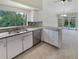Modern kitchen featuring stainless steel appliances and granite countertops at 4934 Samoa Cir # 7, Orlando, FL 32808