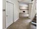 Bright entryway with staircase and view of living room at 4934 Samoa Cir # 7, Orlando, FL 32808