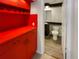 Small bathroom with toilet and red cabinets at 4934 Samoa Cir # 7, Orlando, FL 32808
